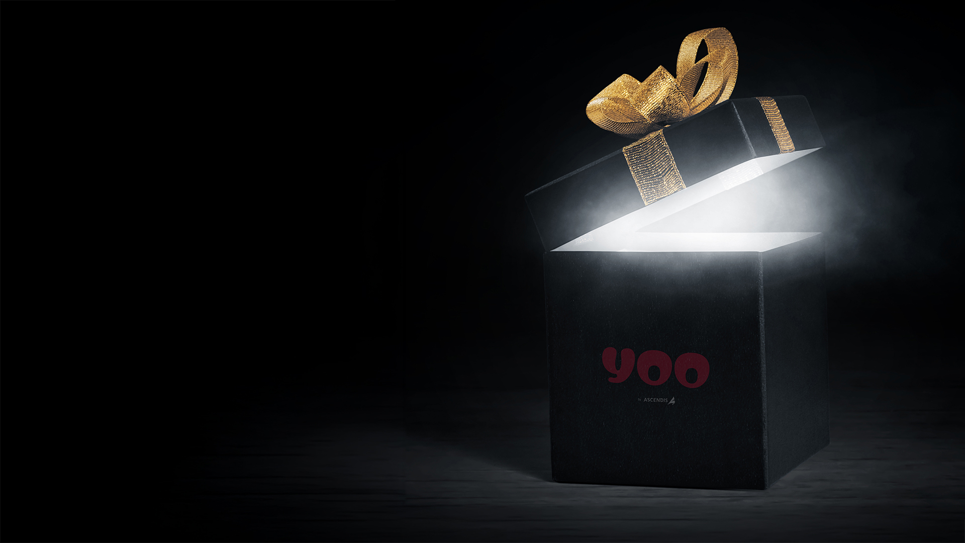 YOO by Ascendis — premium black gift box with golden ribbon glowing from inside